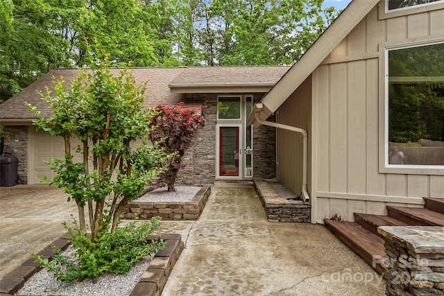 view of exterior entry featuring a garage