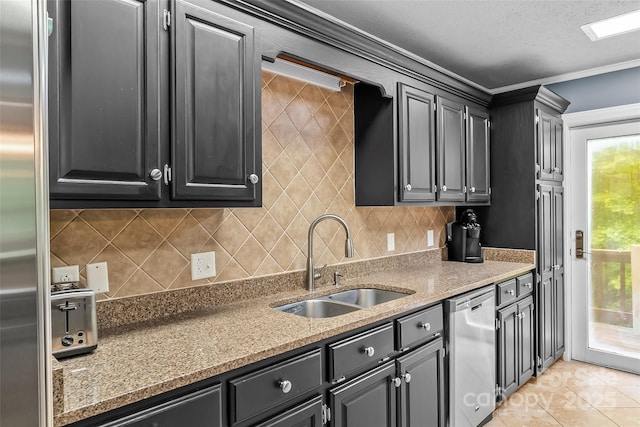 kitchen with tasteful backsplash, sink, stone counters, and stainless steel appliances