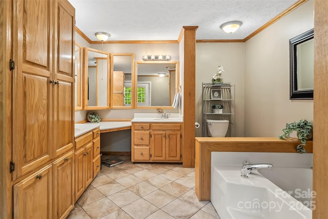 bathroom featuring a bathtub, tile patterned floors, a textured ceiling, crown molding, and vanity