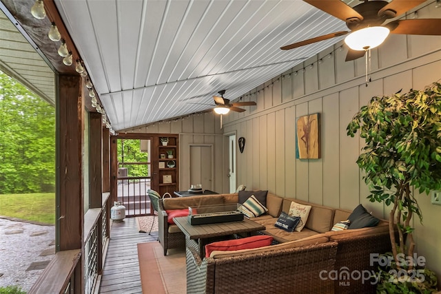 view of patio with ceiling fan and an outdoor living space