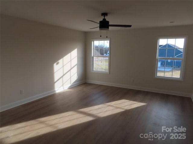 empty room featuring hardwood / wood-style floors and ceiling fan