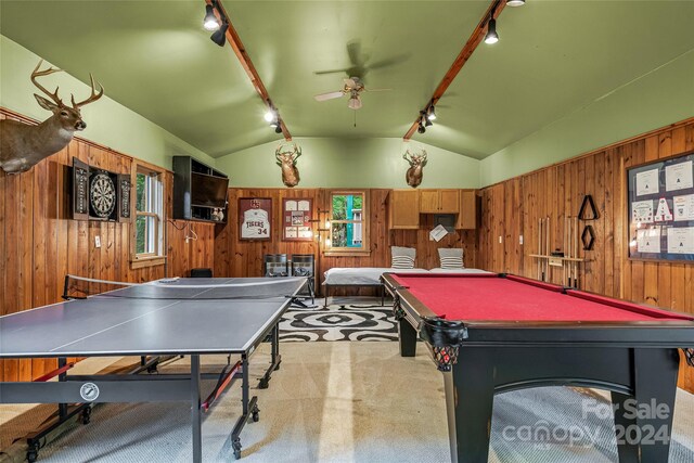 rec room with billiards, vaulted ceiling, wood walls, and rail lighting