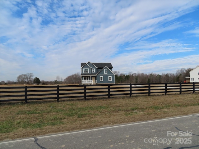 view of yard with a rural view