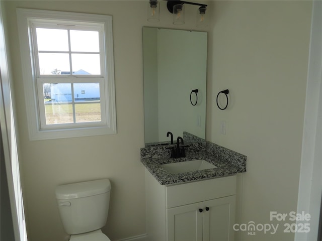 bathroom with vanity and toilet