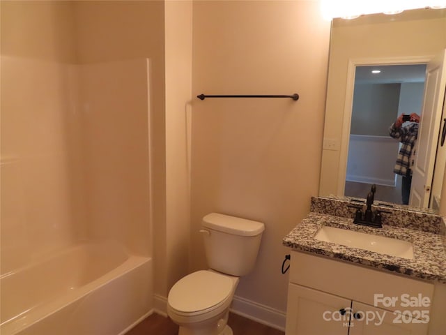 full bathroom featuring shower / bath combination, vanity, and toilet