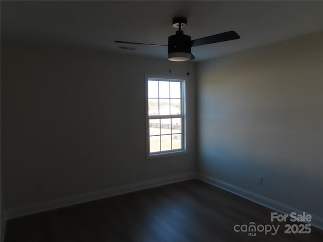 spare room with ceiling fan and hardwood / wood-style floors