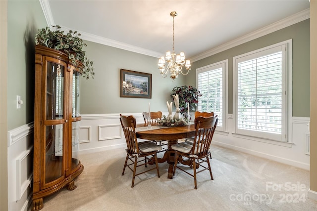 dining area featuring a notable chandelier, light colored carpet, and crown molding