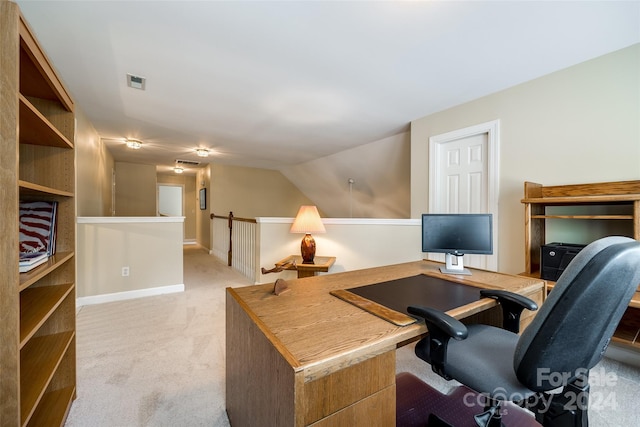 carpeted office featuring lofted ceiling