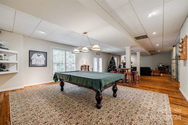 playroom with a paneled ceiling, hardwood / wood-style floors, ornate columns, and pool table