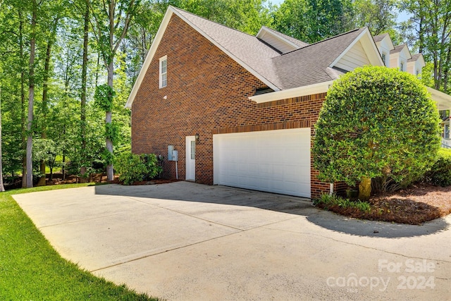 view of side of property with a garage