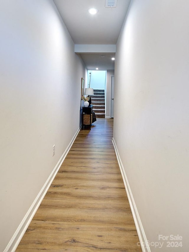 hall featuring wood-type flooring