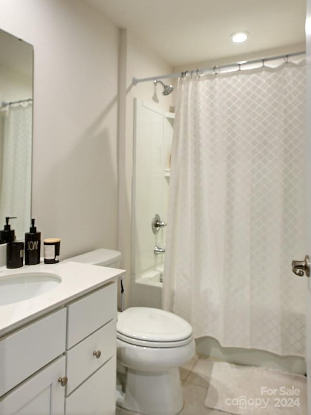 full bathroom with vanity with extensive cabinet space, toilet, tile floors, and shower / tub combo with curtain