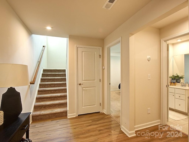 interior space featuring sink and light hardwood / wood-style floors