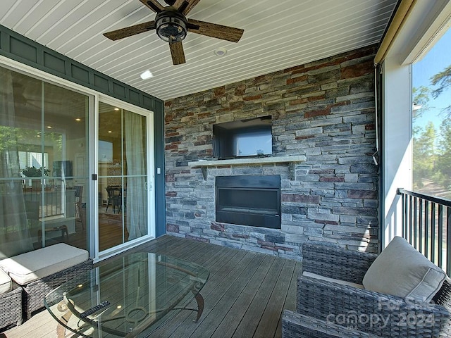 wooden terrace featuring ceiling fan