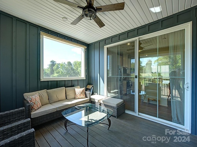 sunroom with wooden ceiling and ceiling fan