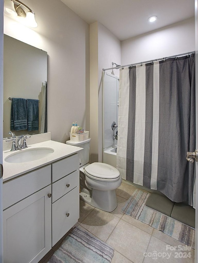 full bathroom featuring shower / bath combo, toilet, tile flooring, and vanity