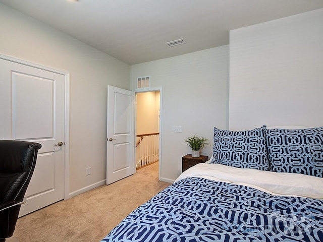 bedroom featuring light colored carpet