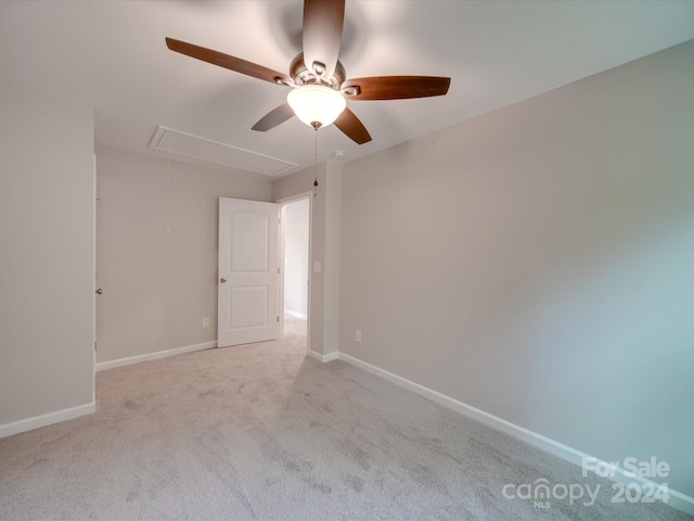 carpeted empty room featuring ceiling fan