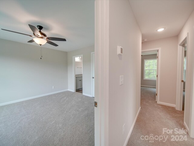 hallway with light carpet