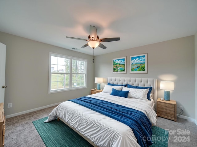 bedroom with ceiling fan and light colored carpet