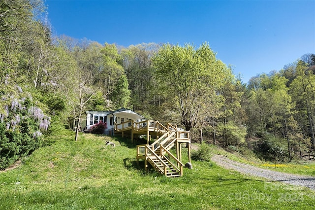 view of yard featuring a wooden deck