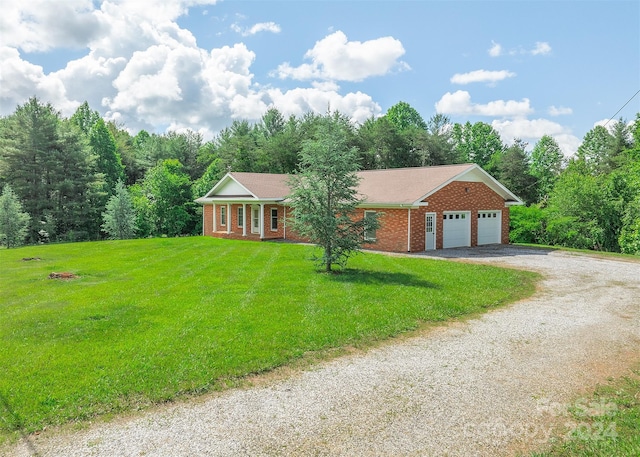 single story home featuring a garage and a front lawn