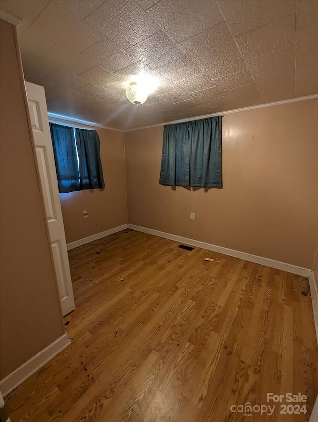 empty room with hardwood / wood-style floors