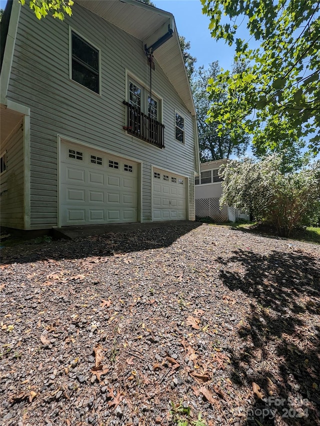 view of property exterior with a garage