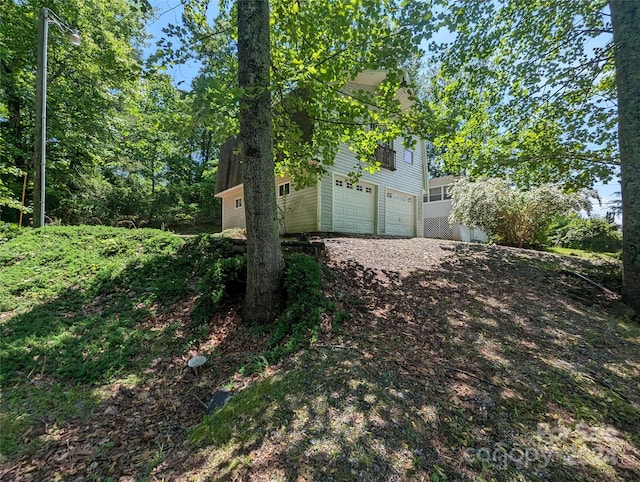 view of yard featuring a garage