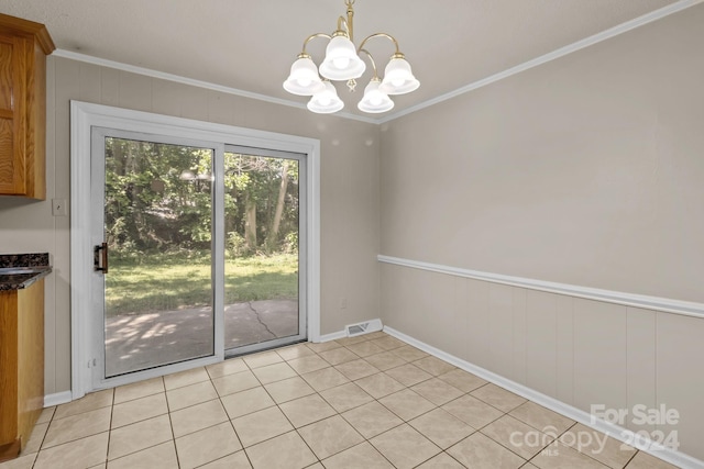 unfurnished dining area with an inviting chandelier, light tile floors, and crown molding