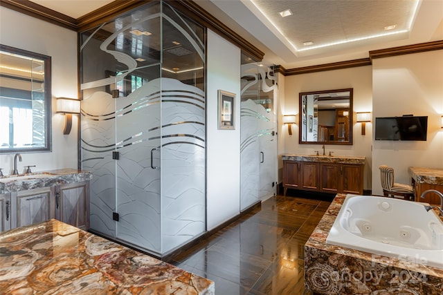 bathroom featuring tile flooring, ornamental molding, a tile shower, vanity, and a raised ceiling