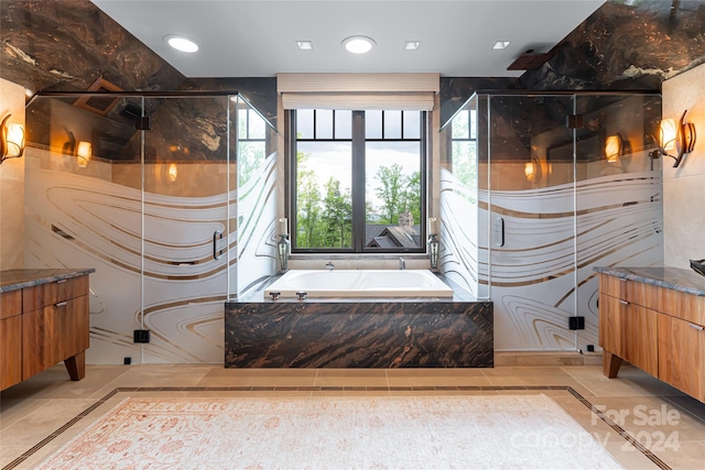 bathroom featuring tile floors, independent shower and bath, and vanity