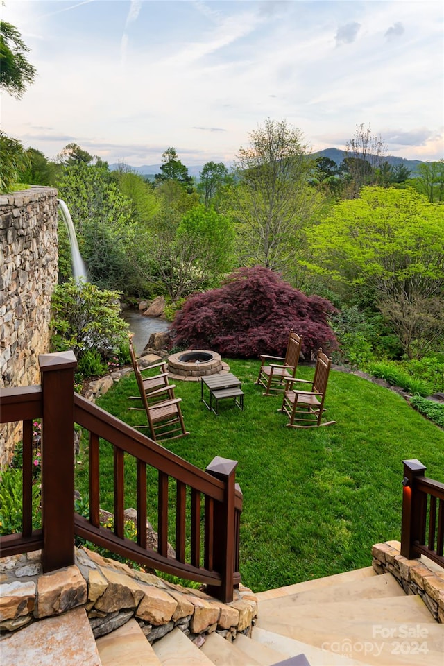 view of yard with a fire pit