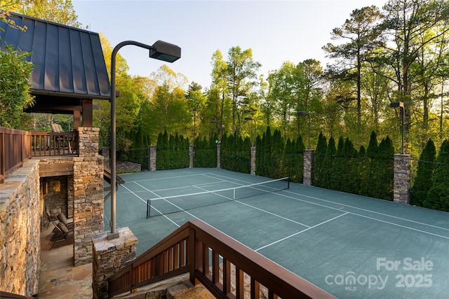 view of sport court with fence