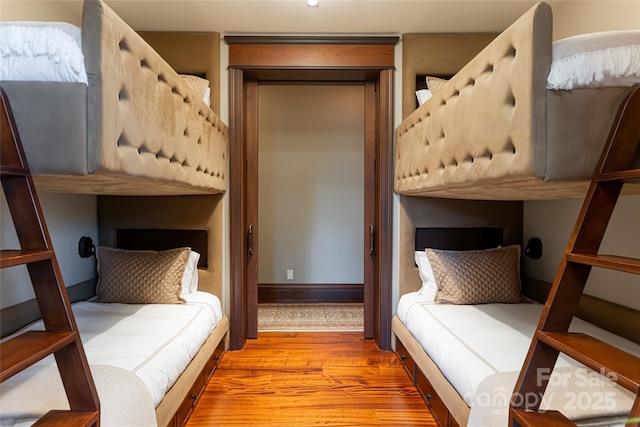 bedroom with wood finished floors