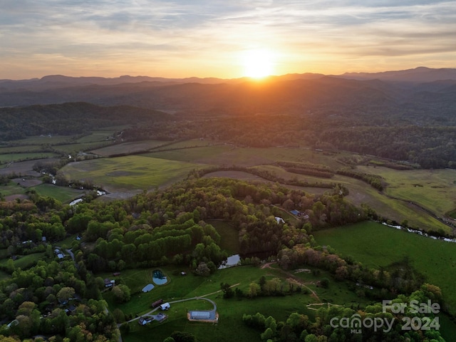 drone / aerial view featuring a mountain view