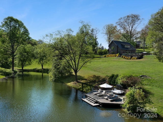 exterior space with a yard and a water view