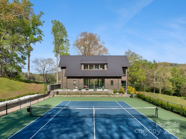 view of sport court with basketball hoop