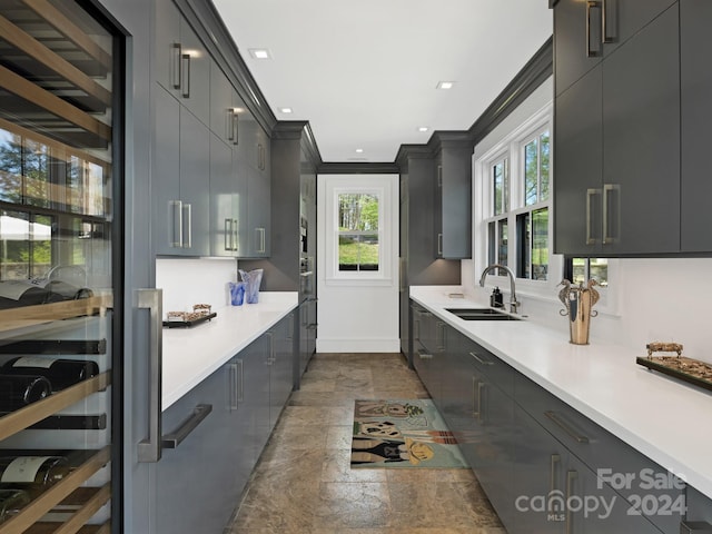 kitchen featuring ornamental molding and sink