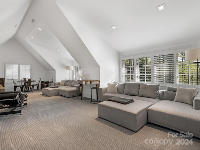 living area featuring vaulted ceiling, recessed lighting, and carpet floors