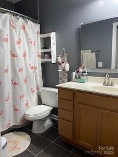 bathroom with a shower with curtain, tile patterned flooring, vanity, and toilet