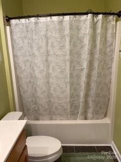 bathroom with tile patterned flooring, toilet, vanity, and shower / tub combo with curtain