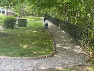 view of home's community featuring a lawn