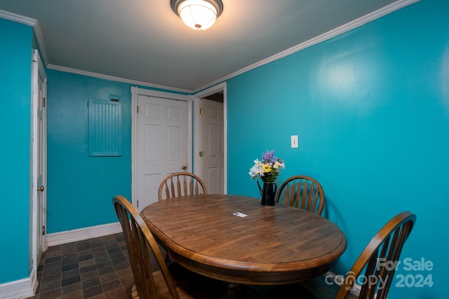 dining room featuring crown molding