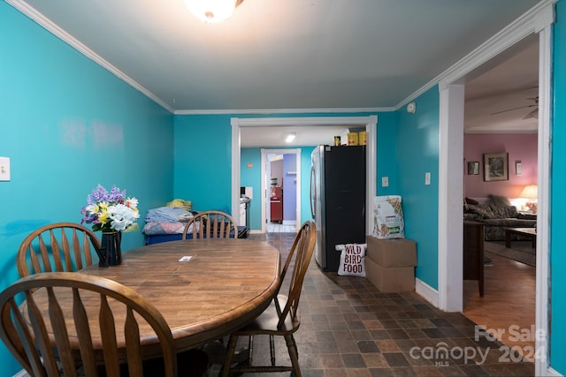 dining room featuring ceiling fan and ornamental molding