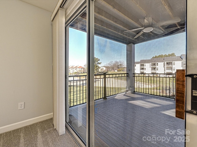 exterior space with ceiling fan