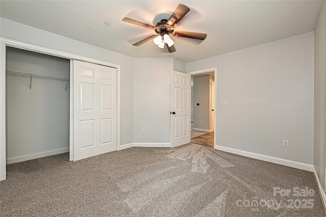 unfurnished bedroom with ceiling fan, a closet, and carpet floors