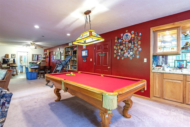 recreation room featuring light colored carpet, ceiling fan, a textured ceiling, and billiards