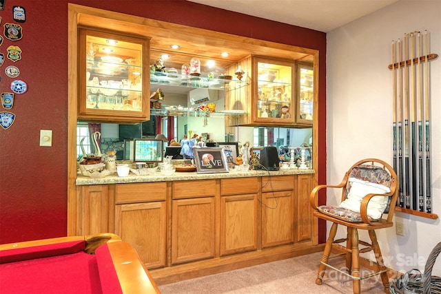 bar featuring light colored carpet, an AC wall unit, billiards, and light stone countertops