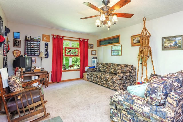 carpeted living room with ceiling fan